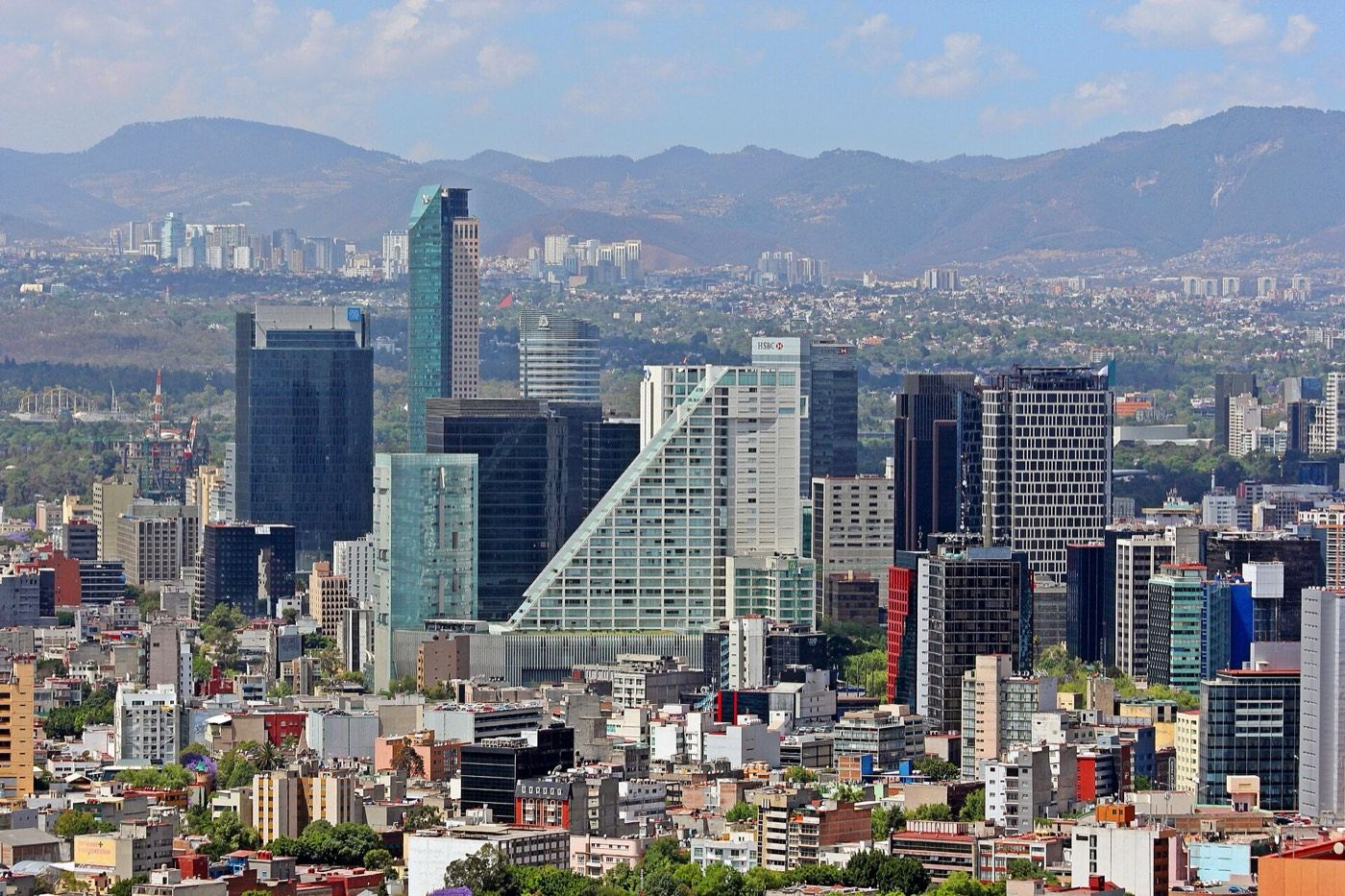The Paseo de la Reforma skyline in Mexico City, with the mountains behind it